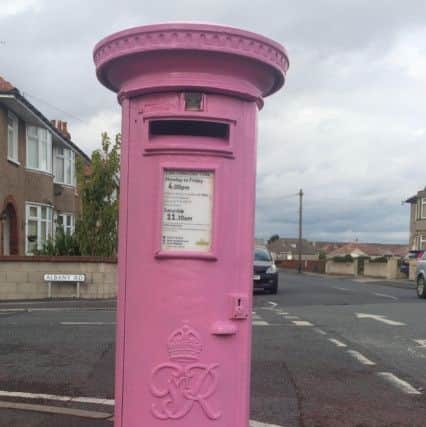 Pink postbox on Acre Moss Lane.