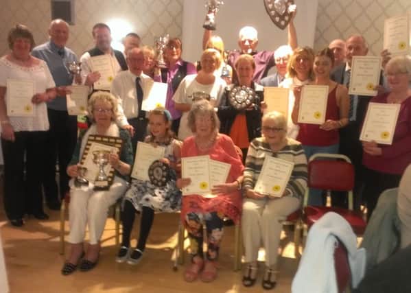 Winners at the Morecambe in Bloom 2015 awards display their trophies and certificates.