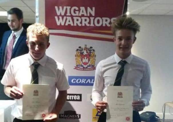Kyle Barton and Ike Eastwood have been handed Wigan Warriors scholarships.