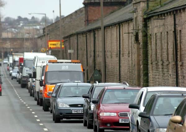 Long queues build up on Lancaster's Caton Road after reports of a man on a canal bridge.