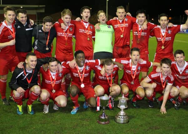 Carnforth Rangers celebrate their Lancashire Cup triumph last season.