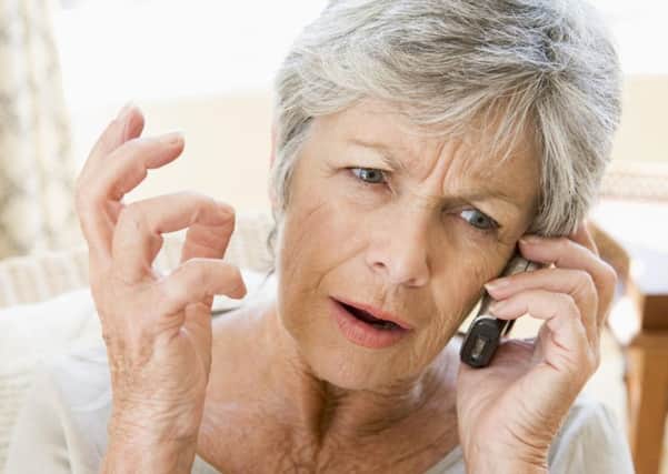Photo of a woman annoyed with a cold caller.