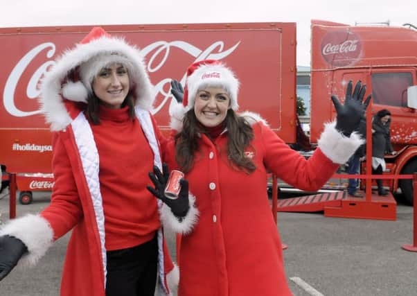 The Coca-Cola Christmas truck arrives in Morecambe in 2014.  Sadie Murphy and Jenna Ball.