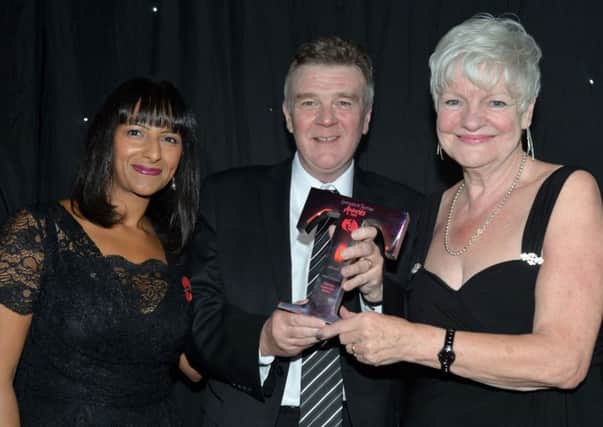 The Lancashire Tourism Awards 2015 at the Empress Ballroom, Blackpool Winter Gardens.
Tourism Superstar Award. Left to right, host Ranvir Singh, winner John 'Gilly' Gillmore and Jennifer Mein, leader of Lancashire County Council.