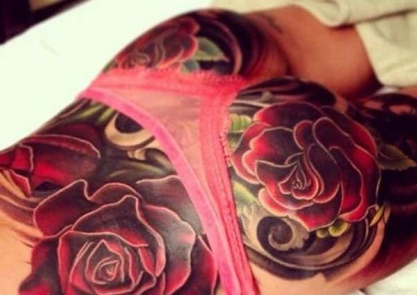 Cheryl Cole's tattooed backside