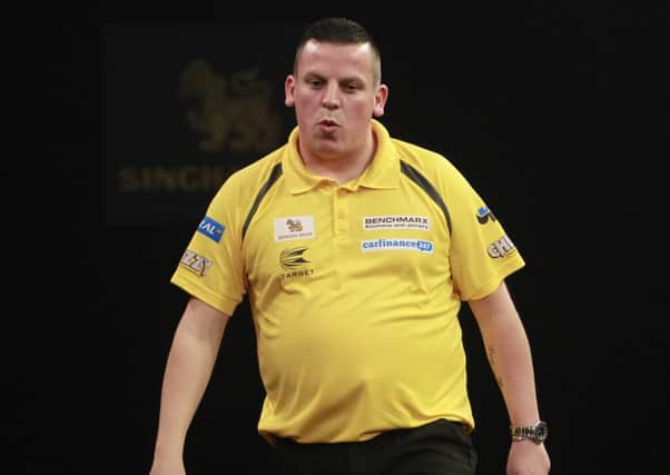 Dave Chisnall rues a missed chance as he bowed out of the Grand Slam of Darts.  Picture: Lawrence Lustig/PDC