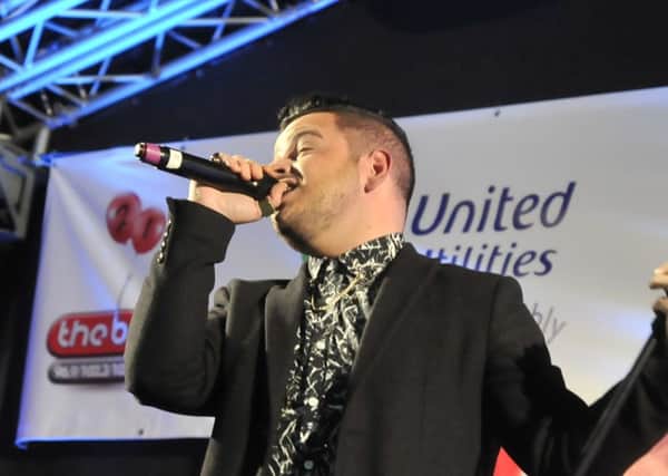 Paul Akister singing at the Lancaster Christmas Lights Switch On in 2014.
