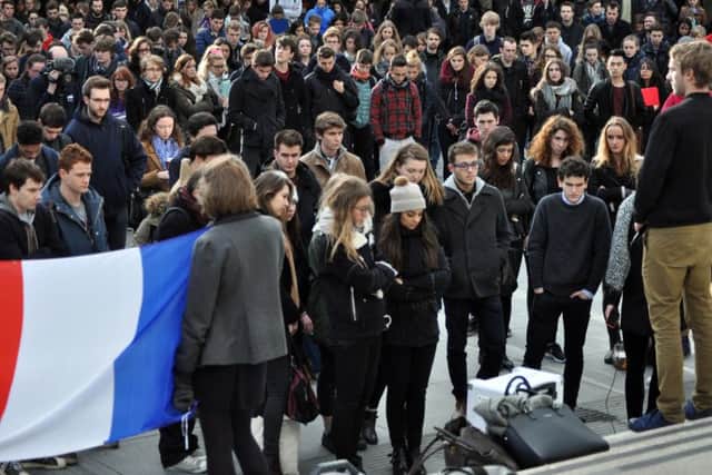 Students in Alexandra Square at Lancaster University during a gathering to pay respects to the victims of the Paris terror attacks.