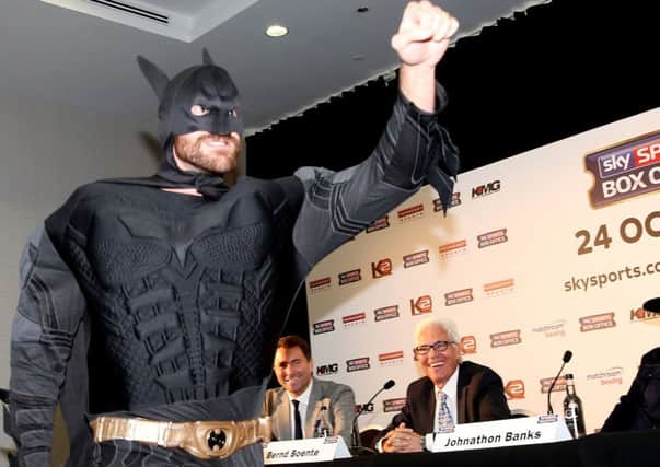 Tyson Fury (left), dressed as Batman during a press conference dressed as batman at the Hilton Syon Park, London. PRESS ASSOCIATION Photo. Picture date: Wednesday September 23, 2015. See PA story BOXING Fury. Photo credit should read: Simon Cooper/PA Wire.