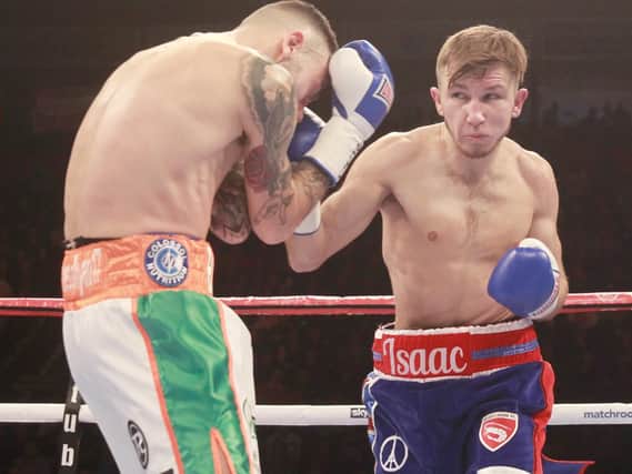 Isaac Lowe goes on the attack against Ryan Doyle. Picture: Lawrence Lustig/Matchroom
