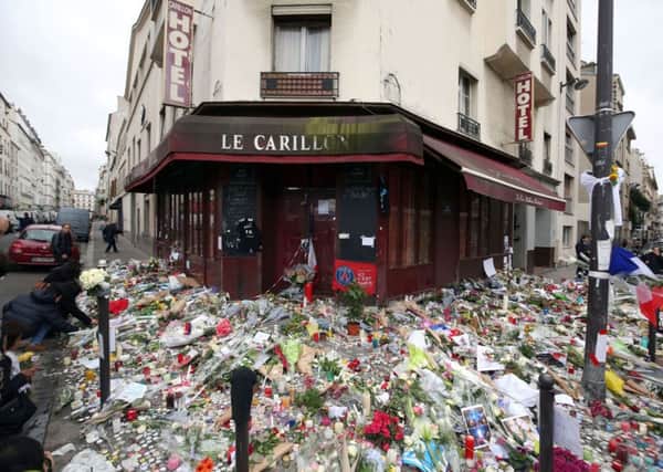 Tributes  in Paris, after terror attacks killed at least 129 people. Terrorists should be called Daesh not Isis says a reader. See letter