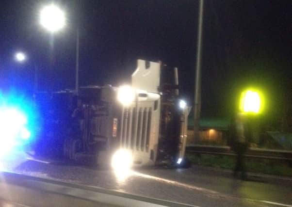 The lorry tipped over onto the grass verge. Photo: Mark Cookson
