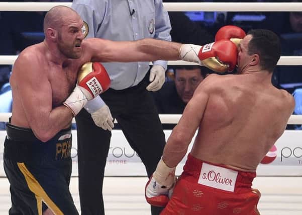 Tyson Fury goes on the attack against Wladimir Klitschko. AP Photo/Sebastian Konopka