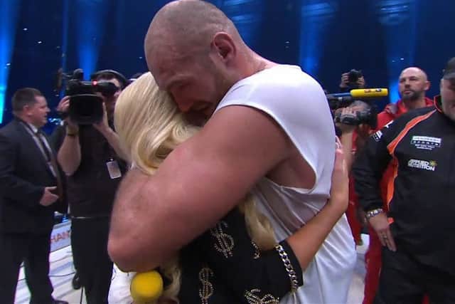 Tyson Fury embraces his wife Paris after singing to her in the ring following his victory over Wladimir Klitschko for the world heavyweight boxing title. Clip from Sky Sports.