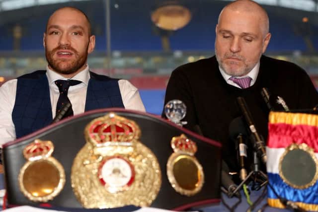 Tyson Fury (left) and trainer Peter Fury during a homecoming event at the Macron Stadium. Picture: Simon Cooper/PA Wire