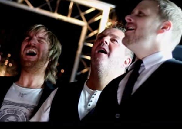 Local singers Jason McLoughlin, Mark McKenna and Stuart Michaels in the video for 'He Ain't Heavy, He's My Brother'.