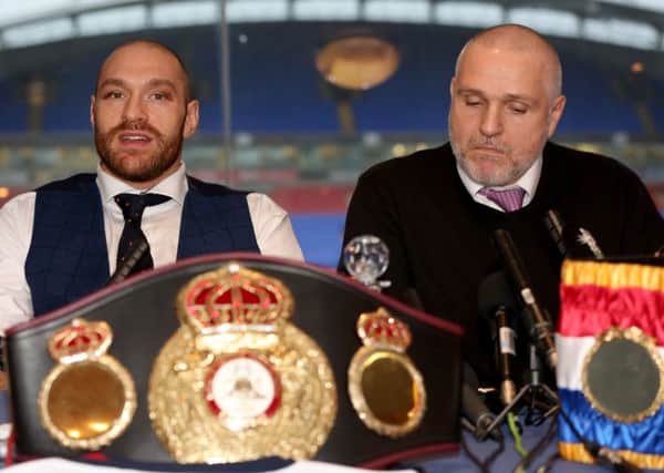 Tyson Fury (left) and trainer Peter Fury. Picture: Simon Cooper/PA Wire