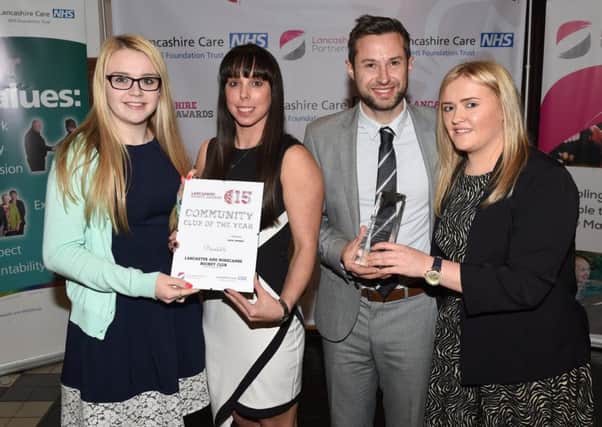 Lancaster and Morecambe Hockey Club pick up their Community Club of the Year Award from special guest Beth Tweddle.