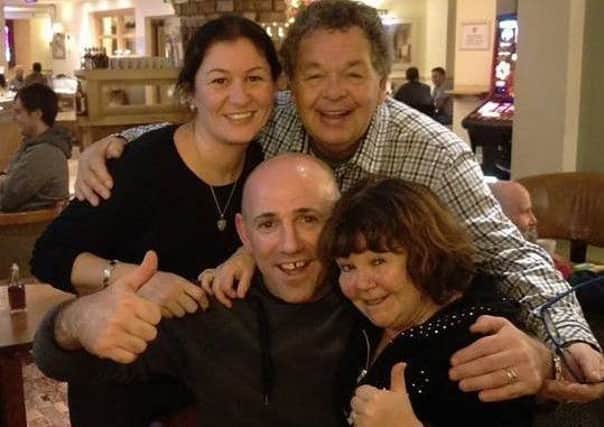 Lee and Debbie Maguire with The Krankies, Ian and Janette Tough, after Lee rescued them from 3ft of water on Caton Road on Saturday night.