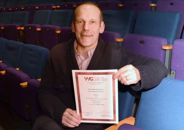 Dukes Artistic Director, Joe Sumsion with his Writers Guild award. Picture by Darren Andrews.