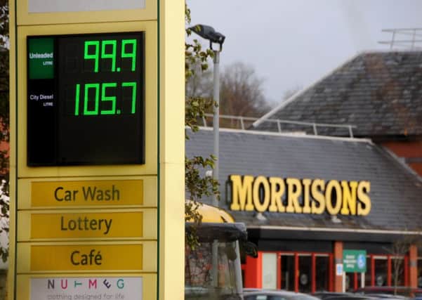 Petrol prices at Morrisons in Riversway, Preston, are advertised at less that a pound