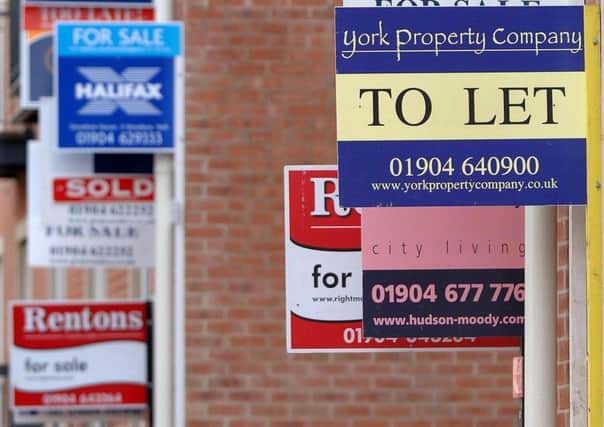 Signs advertising residential property for sale and to let.