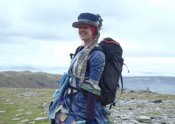 Katie Duxbury wearing her thousand mile dress on a Lake District climb