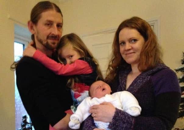 Jerzy, Ola and Anna Wolnik with baby Kuba who was born during the floods of 2015