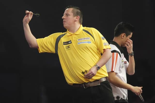 Dave Chisnall in action on Tuesday night. Picture: Lawrence Lustig/PDC