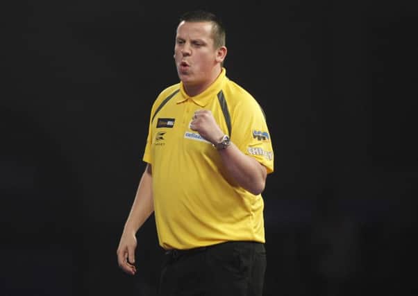 Dave Chisnall on his way to victory over Rowby John-Rodriguez. Picture: Lawrence Lustig/PDC