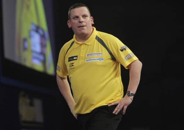 Dave Chisnall looks to the sky as he exits the World Championships. Picture: Lawrence Lustig/PDC