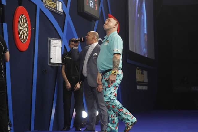 Peter Wright seals his places in the quarter-finals. Picture: Lawrence Lustig/PDC