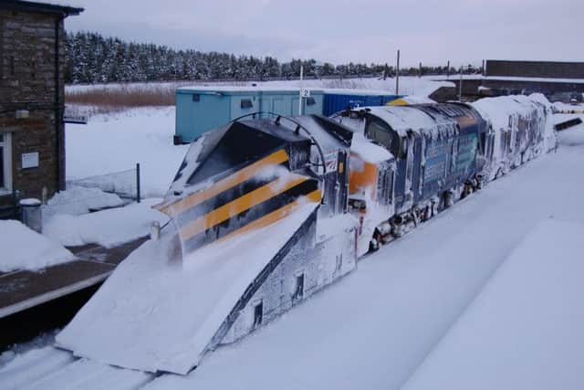 A snow plough in use by Network Rail.