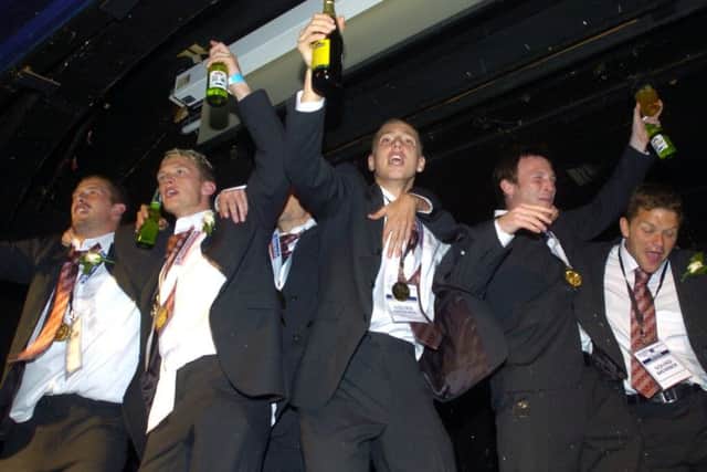 Morecambe FC players celebrate at the Carleton on the night of their Wembley win in 2007.