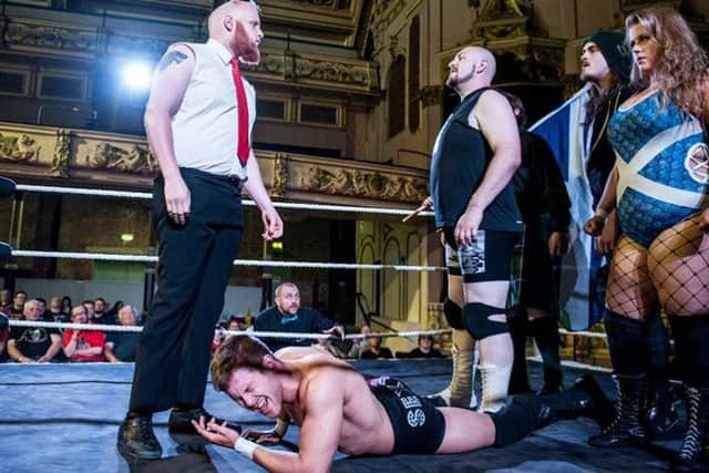 'Mr Big' Shaun Vasey confronts The Referendum to protect his fallen tag team partner Sexy Kev. Photo by Tony Knox.