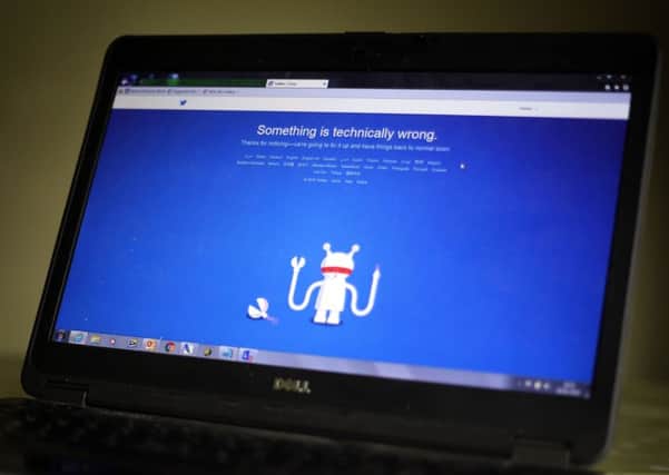 A laptop shows the Twitter website which was down for many users in the UK