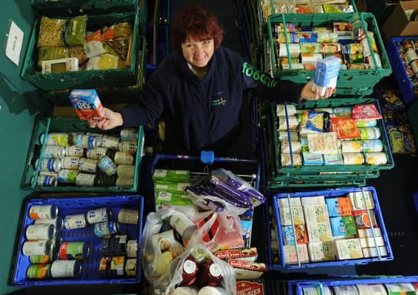 Photo Neil Cross: Annette Smith of the Morecambe Bay Foodbank with food collected.