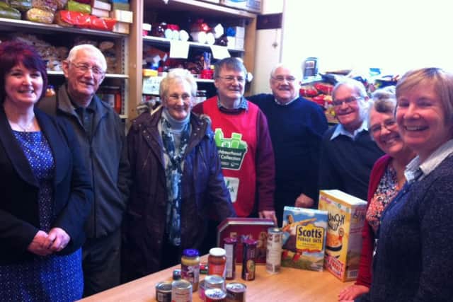 Morecambe Bay Foodbank project manager Annette Smith with volunteers Joe Fisher, Ruth Fisher, Roger Berridge, Tony Ledwidge, Bob Moran, Robin Moran and Jane Berridge in the 'Pick Room' at the foodbank base in the GYM Church on Clarence Street, Morecambe.