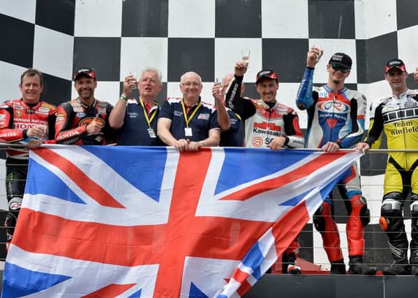 John McGuinness, left, celebrates after Team UK's victory. Picture: Russell Colvin