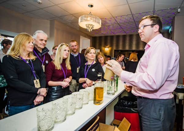 Aspect Bar and Bistro owner, Paul Bury, describes some of the gins to gin lovers.