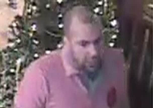 Police want to speak to this man in connection with an attack on bar staff on Boxing Day, 2015.