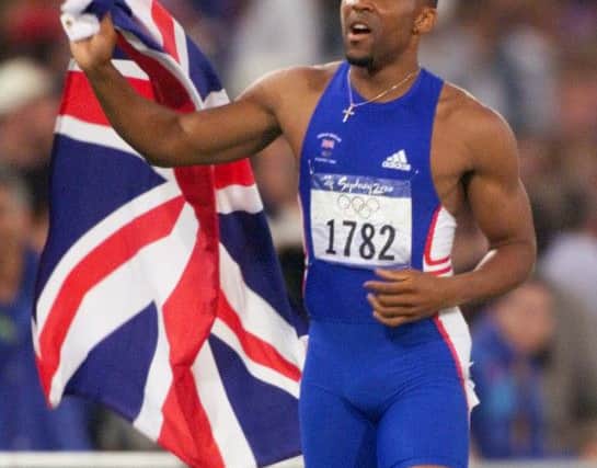 Darren Campbell celebrates after winning silver in the 200m at the Sydney Olympics. AP Photo/Doug Mills