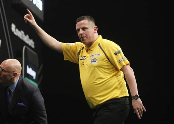 Dave Chisnall in action against Robert Thornton. Picture: Lawrence Lustig.