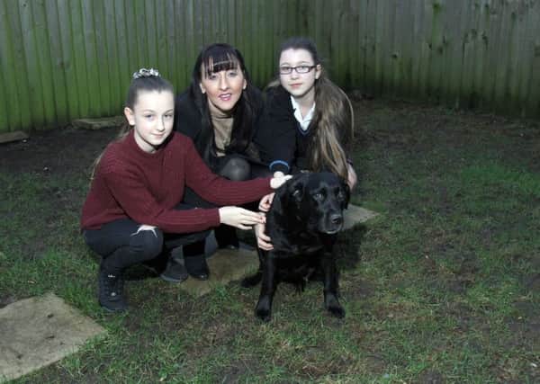 Emma with her daughters Elisha aged 11 and Bethany aged 14 and their dog Jessie