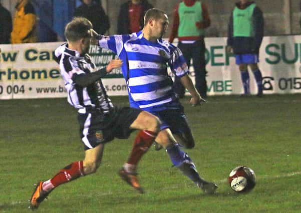 Zach Clark goes for goal against Kendal Town. Picture: Tony North