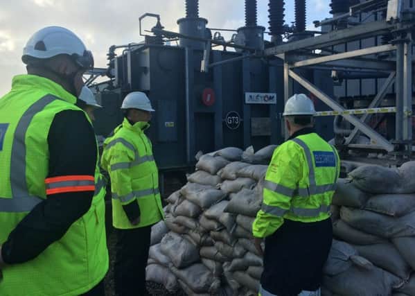 David Morris MP (centre) visits the Caton Road electricity substation.