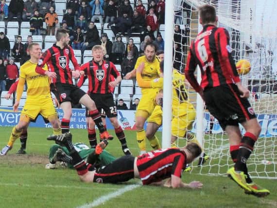 Tom Barkhuizen scores a late consolation for Morecambe.