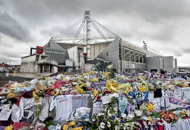 Photo Ian Robinson
Tributes at the Sir Tom Finney Splash Statue at Deepdale