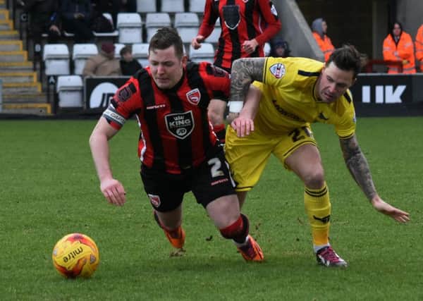 Shaun Beeley battles for the ball against Oxford.