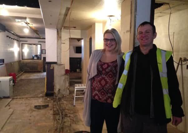 Tia Aspinall and site foreman Manny at The John O' Gaunt, which is undergoing refurbishment